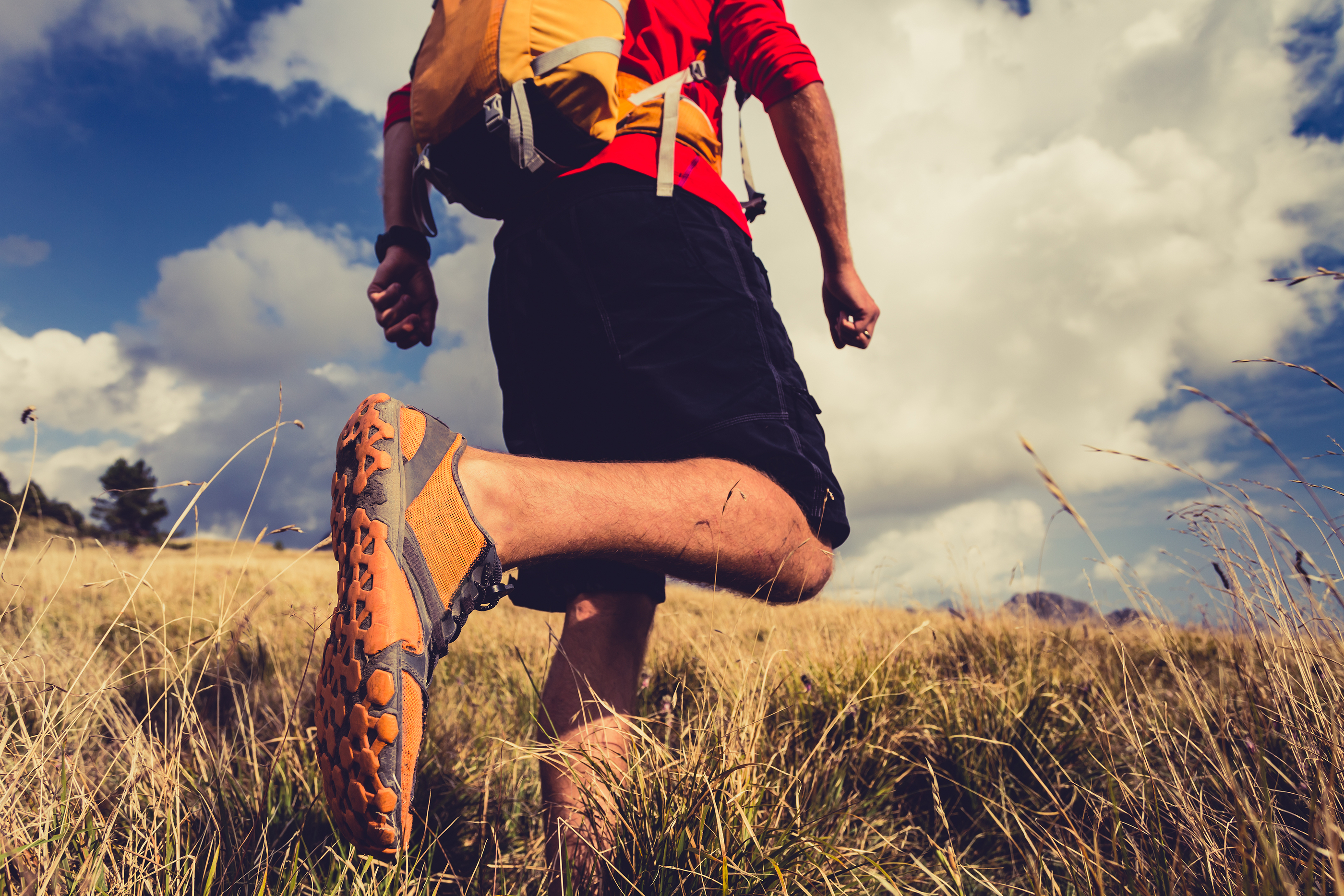 Man running in nature in sports shoe